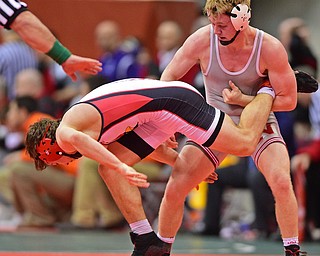 COLUMBUS, OHIO - MARCH 5, 2016: David Crawford of Canfield has his leg taken out by Kyle Myers of Canal Fulton Northwest during their 160lb Division II third place bout Saturday morning at Schottenstein Center. DAVID DERMER | THE VINDICATOR