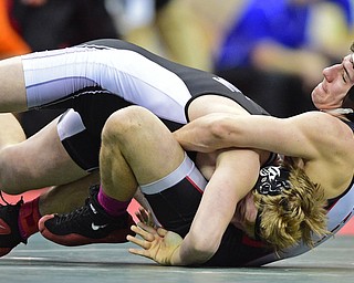 COLUMBUS, OHIO - MARCH 5, 2016: Dominic Cooper of Canfield holds not to he body of Gage Braun of St. Paris Graham Local during their 182lb Division II fifth place bout Saturday morning at Schottenstein Center. DAVID DERMER | THE VINDICATOR