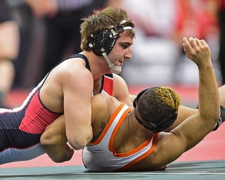 COLUMBUS, OHIO - MARCH 5, 2016: Jacob Esarco of Canfield attempts to work the shoulders of Tristen Weirich of Ashland down to the mat for a pin during their 220lb Division II third place bout Saturday morning at Schottenstein Center. DAVID DERMER | THE VINDICATOR