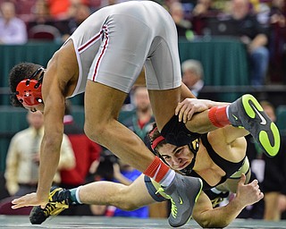 COLUMBUS, OHIO - MARCH 5, 2016: Georgio Poullas of Canfield dives to take the leg of Richard Jackson of Toledo Central Catholic during their 152lb Division 2 Championship bout Saturday night night at Schottenstein Center. DAVID DERMER | THE VINDICATOR