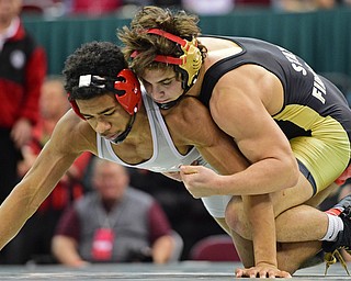 COLUMBUS, OHIO - MARCH 5, 2016: Georgio Poullas of Canfield controls the back of Richard Jackson of Toledo Central Catholic while taking him to the ground during their 152lb Division 2 Championship bout Saturday night night at Schottenstein Center. DAVID DERMER | THE VINDICATOR