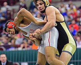 COLUMBUS, OHIO - MARCH 5, 2016: Georgio Poullas of Canfield grabs his arm to prevent Richard Jackson of Toledo Central Catholic from getting an escape during their 152lb Division 2 Championship bout Saturday night night at Schottenstein Center. DAVID DERMER | THE VINDICATOR