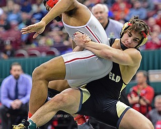COLUMBUS, OHIO - MARCH 5, 2016: Georgio Poullas of Canfield drags Richard Jackson of Toledo Central Catholic down to the mat during their 152lb Division 2 Championship bout Saturday night night at Schottenstein Center. DAVID DERMER | THE VINDICATOR
