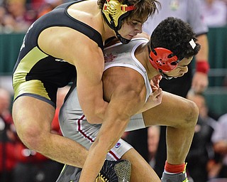 COLUMBUS, OHIO - MARCH 5, 2016: Georgio Poullas of Canfield controls the back of Richard Jackson of Toledo Central Catholic while working him down to the mat during their 152lb Division 2 Championship bout Saturday night night at Schottenstein Center. DAVID DERMER | THE VINDICATOR