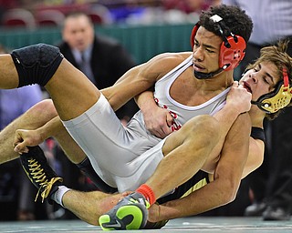 COLUMBUS, OHIO - MARCH 5, 2016: Georgio Poullas of Canfield controls the back of Richard Jackson of Toledo Central Catholic while working him down to the mat during their 152lb Division 2 Championship bout Saturday night night at Schottenstein Center. DAVID DERMER | THE VINDICATOR