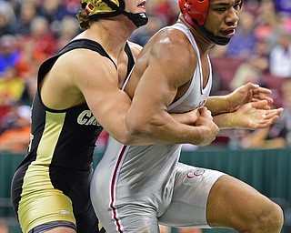 COLUMBUS, OHIO - MARCH 5, 2016: Georgio Poullas of Canfield holds on to the body of Richard Jackson of Toledo Central Catholic while attempting to keep him from breaking free during their 152lb Division 2 Championship bout Saturday night night at Schottenstein Center. DAVID DERMER | THE VINDICATOR