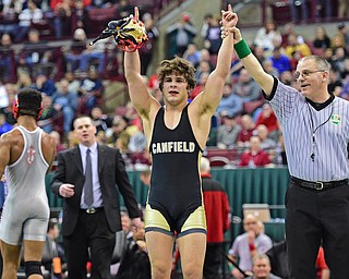 COLUMBUS, OHIO - MARCH 5, 2016: Georgio Poullas of Canfield has his arm raised in victory by the referee after defeating Richard Jackson of Toledo Central Catholic in their 152lb Division 2 Championship bout Saturday night night at Schottenstein Center. DAVID DERMER | THE VINDICATOR