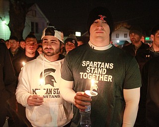 William d Lewis the vindicator  Chris LaCivita, left, and Tim Taafe were among the more than 200 people who gathered 3-5-16 on Orchard Ave in Hubbard for vigil to remember Cody Pitts who was murdered near tht site. They played football with Pitts while he was a student at Hubard HS.