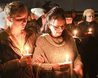 William d Lewis the vindicator  Sarah Skruck, left, and Lisa Baughman were among the more than 200 people who gathered 3-5-16 on Orchard Ave in Hubbard for vigil to remember Cody Pitts who was murdered near tht site.