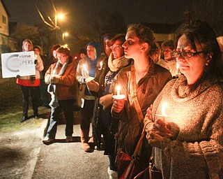 William d Lewis the vindicator  Sarah Skruck, left, and Lisa Baughman were among the more than 200 people who gathered 3-5-16 on Orchard Ave in Hubbard for vigil to remember Cody Pitts who was murdered near tht site.