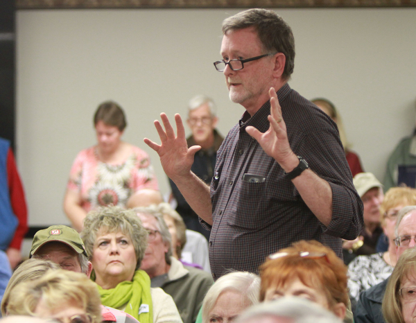 William d Lewis The vindicator Chris Travers of Youngstown, speaks at a public meeting Monday 3-7-16 concerning recent Mill Creek PArk happenings. About 200 people attended the event.