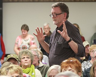 William d Lewis The vindicator Chris Travers of Youngstown, speaks at a public meeting Monday 3-7-16 concerning recent Mill Creek PArk happenings. About 200 people attended the event.