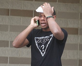      ROBERT K. YOSAY  | THE VINDICATOR..Students and police inside of East High School when a series of fights broke out Tuesday morning all agree that the scene was chaotic..More than two dozen officers responded to the school after a fight about 11:10 a.m. that was broken up, then escalated into a series of several other fights Ñ resulting in chemical spray being used to help control those brawling...--30-...