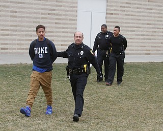      ROBERT K. YOSAY  | THE VINDICATOR..Students and police inside of East High School when a series of fights broke out Tuesday morning all agree that the scene was chaotic..More than two dozen officers responded to the school after a fight about 11:10 a.m. that was broken up, then escalated into a series of several other fights Ñ resulting in chemical spray being used to help control those brawling...--30-...