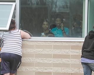      ROBERT K. YOSAY  | THE VINDICATOR..Students and police inside of East High School when a series of fights broke out Tuesday morning all agree that the scene was chaotic..More than two dozen officers responded to the school after a fight about 11:10 a.m. that was broken up, then escalated into a series of several other fights Ñ resulting in chemical spray being used to help control those brawling...--30-...
