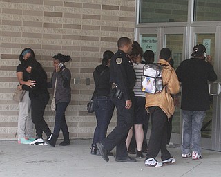      ROBERT K. YOSAY  | THE VINDICATOR..Students and police inside of East High School when a series of fights broke out Tuesday morning all agree that the scene was chaotic..More than two dozen officers responded to the school after a fight about 11:10 a.m. that was broken up, then escalated into a series of several other fights Ñ resulting in chemical spray being used to help control those brawling...--30-...