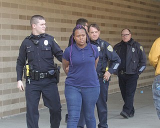     ROBERT K. YOSAY  | THE VINDICATOR..Students and police inside of East High School when a series of fights broke out Tuesday morning all agree that the scene was chaotic..More than two dozen officers responded to the school after a fight about 11:10 a.m. that was broken up, then escalated into a series of several other fights Ñ resulting in chemical spray being used to help control those brawling...--30-...