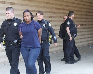      ROBERT K. YOSAY  | THE VINDICATOR..Students and police inside of East High School when a series of fights broke out Tuesday morning all agree that the scene was chaotic..More than two dozen officers responded to the school after a fight about 11:10 a.m. that was broken up, then escalated into a series of several other fights Ñ resulting in chemical spray being used to help control those brawling...--30-...
