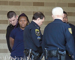      ROBERT K. YOSAY  | THE VINDICATOR..Students and police inside of East High School when a series of fights broke out Tuesday morning all agree that the scene was chaotic..More than two dozen officers responded to the school after a fight about 11:10 a.m. that was broken up, then escalated into a series of several other fights Ñ resulting in chemical spray being used to help control those brawling...--30-...