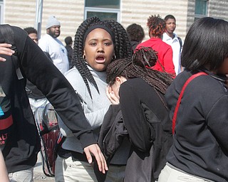      ROBERT K. YOSAY  | THE VINDICATOR..Students and police inside of East High School when a series of fights broke out Tuesday morning all agree that the scene was chaotic..More than two dozen officers responded to the school after a fight about 11:10 a.m. that was broken up, then escalated into a series of several other fights Ñ resulting in chemical spray being used to help control those brawling...--30-...