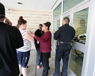      ROBERT K. YOSAY  | THE VINDICATOR..Students and police inside of East High School when a series of fights broke out Tuesday morning all agree that the scene was chaotic..More than two dozen officers responded to the school after a fight about 11:10 a.m. that was broken up, then escalated into a series of several other fights Ñ resulting in chemical spray being used to help control those brawling...--30-...