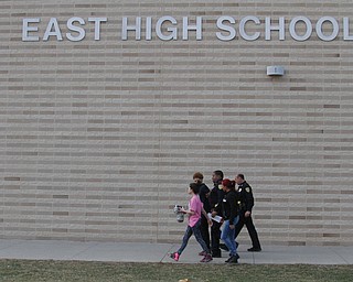      ROBERT K. YOSAY  | THE VINDICATOR..Students and police inside of East High School when a series of fights broke out Tuesday morning all agree that the scene was chaotic..More than two dozen officers responded to the school after a fight about 11:10 a.m. that was broken up, then escalated into a series of several other fights Ñ resulting in chemical spray being used to help control those brawling...--30-...