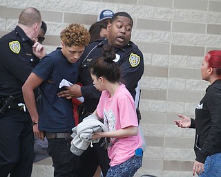      ROBERT K. YOSAY  | THE VINDICATOR..Students and police inside of East High School when a series of fights broke out Tuesday morning all agree that the scene was chaotic..More than two dozen officers responded to the school after a fight about 11:10 a.m. that was broken up, then escalated into a series of several other fights Ñ resulting in chemical spray being used to help control those brawling...--30-...