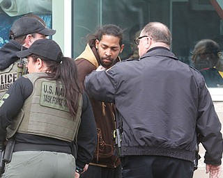      ROBERT K. YOSAY  | THE VINDICATOR..Students and police inside of East High School when a series of fights broke out Tuesday morning all agree that the scene was chaotic..More than two dozen officers responded to the school after a fight about 11:10 a.m. that was broken up, then escalated into a series of several other fights Ñ resulting in chemical spray being used to help control those brawling...--30-...