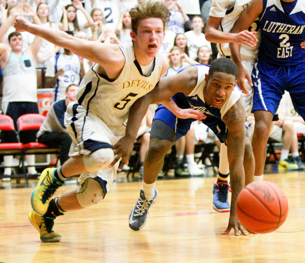 William D. Lewis The Vindicator  McDonald's Zack Fedyski(5) KaylinHeard(5) of Lutheraneast during McDonald's loss to Lutheran East in Canton 3-8-16.