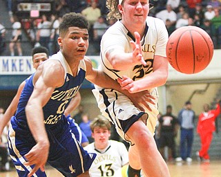 William D. Lewis The Vindicator  McDonald'sMatt howard(32) and AlexanderHeath(0) of Lutheran East go for the ball during McDonald's loss to Lutheran East in Canton 3-8-16.