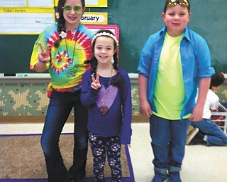 SPECIAL TO THE VINDICATOR | Staff and students at St. Patrick School in Hubbard dressed up in the fashion of the decade of their choice as part of Catholic Schools Week activities. Some of the students who got involved were Alexa Lindholm, left, Rachel Lucarelli and Gabe Hamrock.