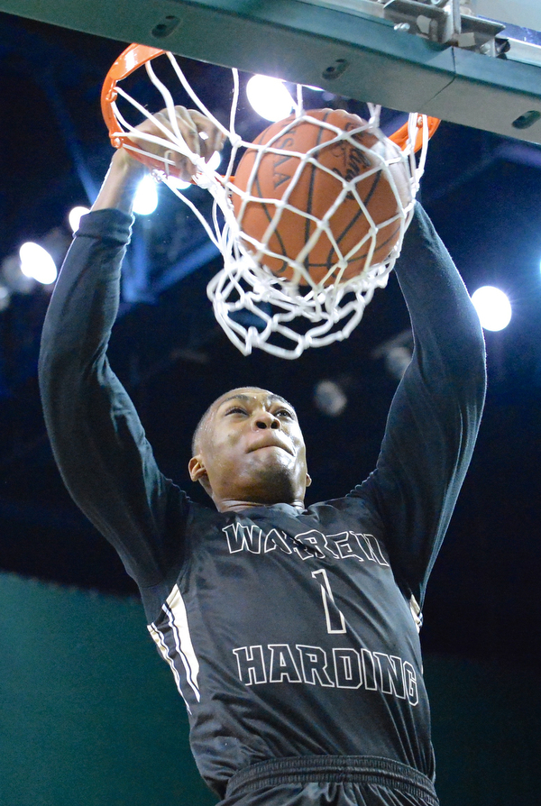 Jeff Lange | The Vindicator  WED, MAR 9, 2016 - Warren Harding's Derek Culver slams the ball through the hoop for two in the first half of the Raiders' 49-43 loss to Garfield Heights in the Division I regional semifinal held at the Wolstein Center in Cleveland on Wednesday.