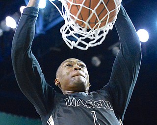 Jeff Lange | The Vindicator  WED, MAR 9, 2016 - Warren Harding's Derek Culver slams the ball through the hoop for two in the first half of the Raiders' 49-43 loss to Garfield Heights in the Division I regional semifinal held at the Wolstein Center in Cleveland on Wednesday.