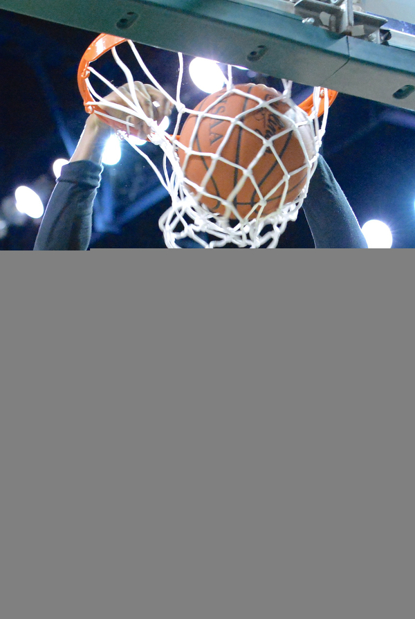 Jeff Lange | The Vindicator  WED, MAR 9, 2016 - Warren Harding's Derek Culver slams the ball through the hoop for two in the first half of the Raiders' 49-43 loss to Garfield Heights in the Division I regional semifinal held at the Wolstein Center in Cleveland on Wednesday.