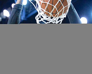 Jeff Lange | The Vindicator  WED, MAR 9, 2016 - Warren Harding's Derek Culver slams the ball through the hoop for two in the first half of the Raiders' 49-43 loss to Garfield Heights in the Division I regional semifinal held at the Wolstein Center in Cleveland on Wednesday.