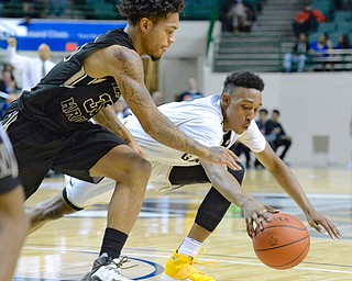 Jeff Lange | The Vindicator  WED, MAR 9, 2016 - Harding's Lynn Bowden (left) dives for the ball against Garfield Heights' Frankie Hughes in the third quarter of their Division I regional semifinal held at the Wolstein Center in Cleveland on Wednesday.