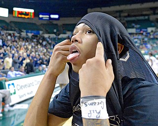 Jeff Lange | The Vindicator  WED, MAR 9, 2016 - Warren Harding junior Tiryn Frank looks to the scoreboard as he rips his jersey off after losing, 49-43, to Garfield Heights in a Division I regional semifinal at the Wolstein Center on Wednesday.