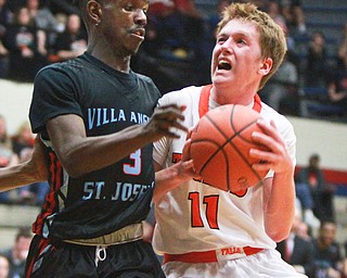 William d Lewis the Vindicator  N Falls Joey Urso(11)) passes around VASJ Kevin roberts(3)) during 3-8-16 action in Canton.