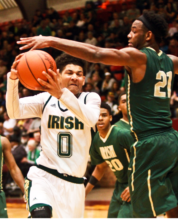 William D Lewis the Vindicator Ursuline's Mike Hughes(0) drives past SMSV's Justin Sampson(21) during 3-10-16 action in Canton