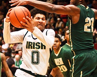 William D Lewis the Vindicator Ursuline's Mike Hughes(0) drives past SMSV's Justin Sampson(21) during 3-10-16 action in Canton