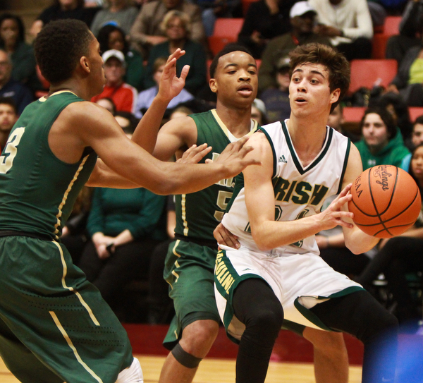 William D Lewis the Vindicator Ursuline's Greg Parella keeps the ball from SVSM's Jayvon Graves(3) and John williams(5)