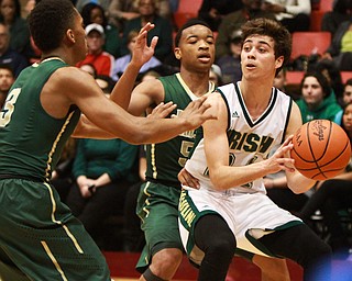 William D Lewis the Vindicator Ursuline's Greg Parella keeps the ball from SVSM's Jayvon Graves(3) and John williams(5)