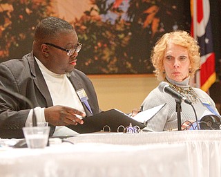      ROBERT K. YOSAY  | THE VINDICATOR..Checking a word  Judges Rev Lewis Macklin and Carol Ryan ..THE VINDICATOR 83rd Regional Spelling Bee  at YSU Kilcawley Room...--30-...