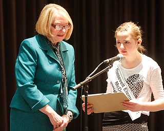      ROBERT K. YOSAY  | THE VINDICATOR..Nena Perkins - Bee Coordinator... listens as she spells a word before taking the tablet to the judges.....Mariah Milan Leskovac - spells a word by pen and ink- Mariah is main schooled and won her bee at Roosevelt Elementary McDonald... the pen and ink were to be sure of the spelling as she has a hearing impairment..THE VINDICATOR 83rd Regional Spelling Bee  at YSU Kilcawley Room...--30-...