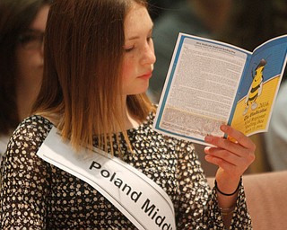      ROBERT K. YOSAY  | THE VINDICATOR..Checking out the competition - as Haley Trolio reads the list of  competitors at the BEE..THE VINDICATOR 83rd Regional Spelling Bee  at YSU Kilcawley Room...--30-...