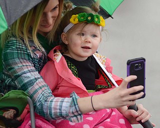 Katie Rickman | The Vindicator.Ashley Tanner of Boardman holds her 15-month-old daughter violet as she takes a photo with her while waiting for the the St. Patricks Day Parade in Boardman to begin on Sunday afternoon.