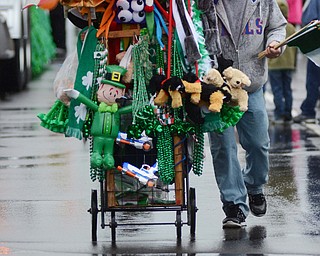 Katie Rickman | The Vindicator.A peddler walks down Rt. 224 selling St. Patricks Day themed items to parade goers during the St. Patricks Day Parade in Boardman on Sunday afternoon.