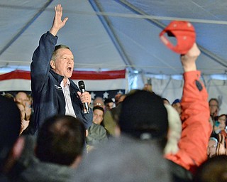 Jeff Lange | The Vindicator  SUN, MAR 13, 2016 - Ohio Governor John Kasich waves goodbye to his supporters after his presidential campaign rally held at Spread Eagle Tavern in Hanoverton Sunday afternoon.