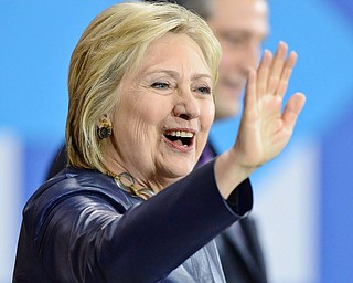 Jeff Lange | The Vindicator  SAT, MAR 12, 2016 - Democratic presidential candidate Hillary Clinton waves to the crowd as she takes the stage at her campaign rally in Youngstown Saturday night.