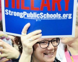 Jeff Lange | The Vindicator  SAT, MAR 12, 2016 - Jan Lawrence of Boardman grins as she holds a Hillary sign during Democratic presidential candidate Hillary Clinton's rally in Youngstown Saturday night.